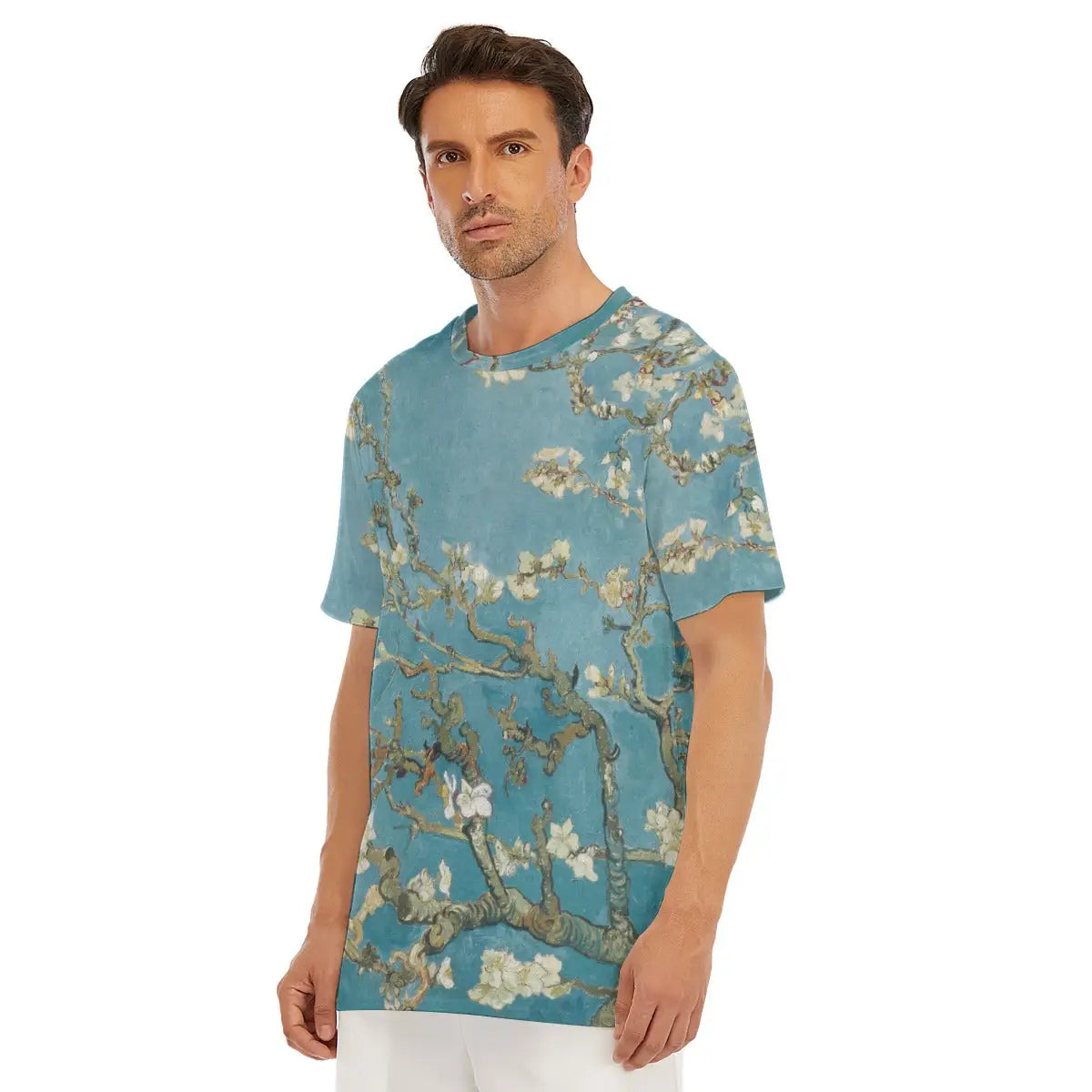Detail of round neckline and shoulder on Almond Blossom T-shirt, showing how the turquoise background and white flowers elegantly blend with different parts of the cut and quality cotton material