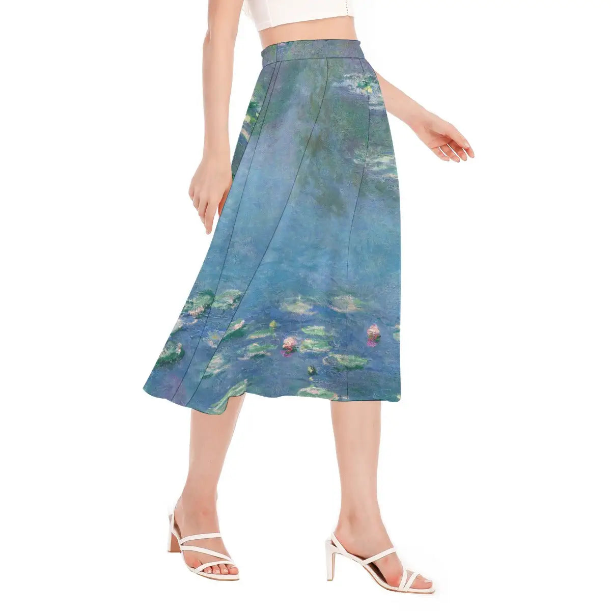 Woman wearing Claude Monet Water Lilies Chiffon Skirt with white blouse walking through garden path with dappled sunlight