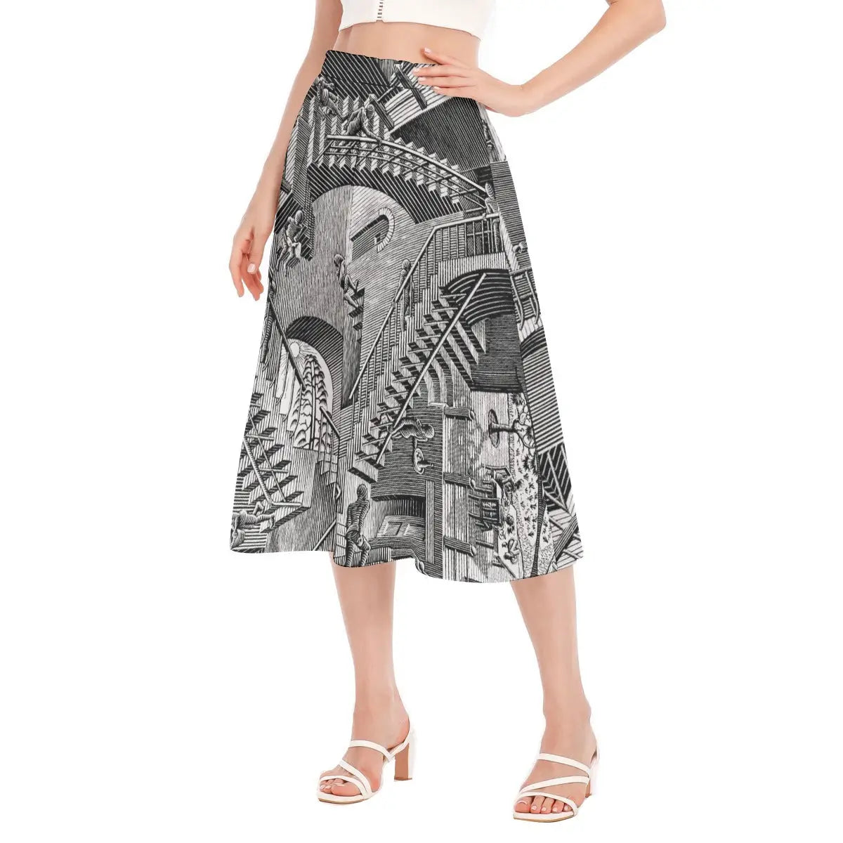 Full-length photo of flowing eco-friendly skirt featuring Escher's mathematical illusion paired with a simple black top that enhances the graphic black and white design.