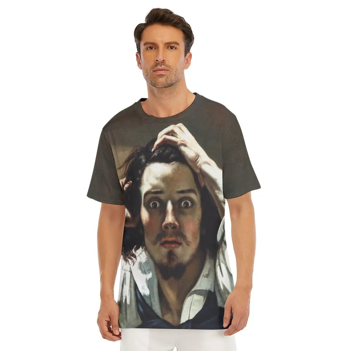 Male model wearing The Desperate Man by Gustave Courbet All-Over Print T-shirt showcasing the intense close-up self-portrait with its haunting wide-eyed stare and hands clutching disheveled hair in a gesture of profound anxiety