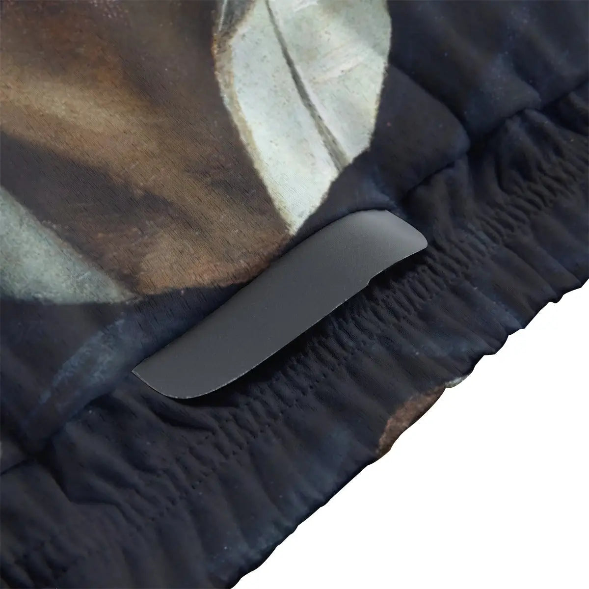 Detailed view of Courbet's intense wide-eyed self-portrait reproduced on women's cycling jersey