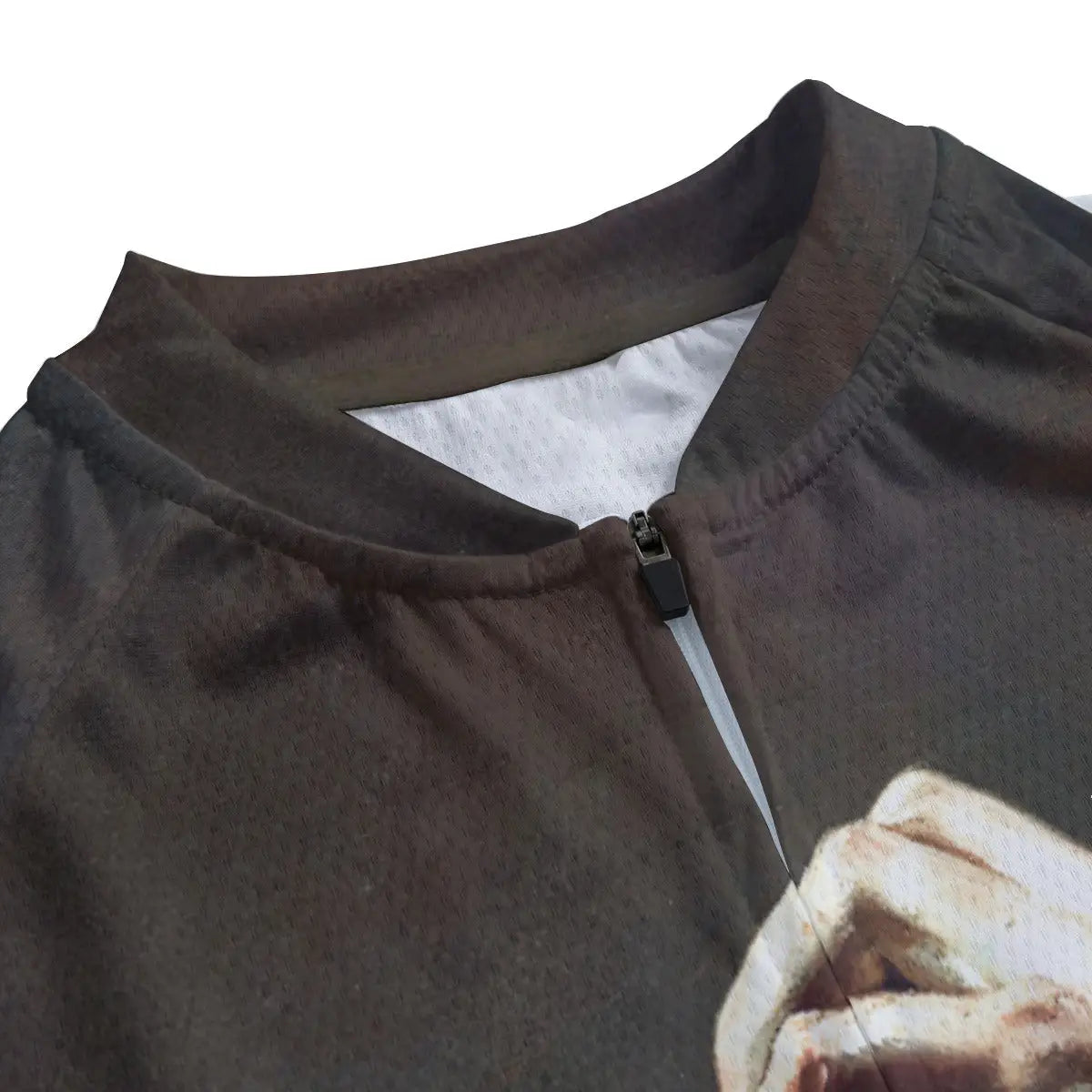 Close-up of secure non-slip rubber hem on Courbet cycling jersey maintaining position during intense ride
