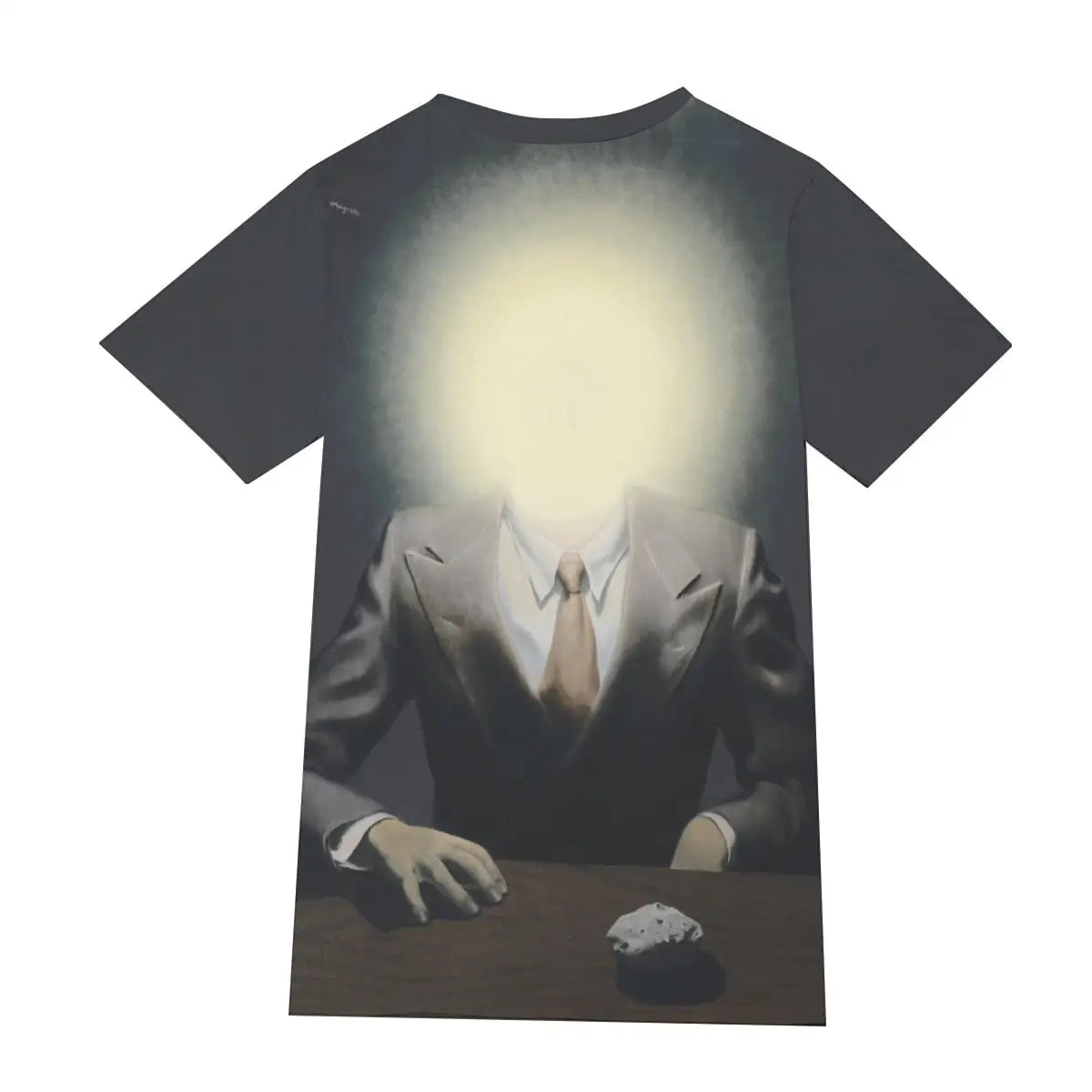 Detail of round neckline and shoulder on The Pleasure Principle T-shirt, highlighting how Magritte's distinctive contrast between conventional realism and impossible imagery flows naturally across different parts of the premium cotton material