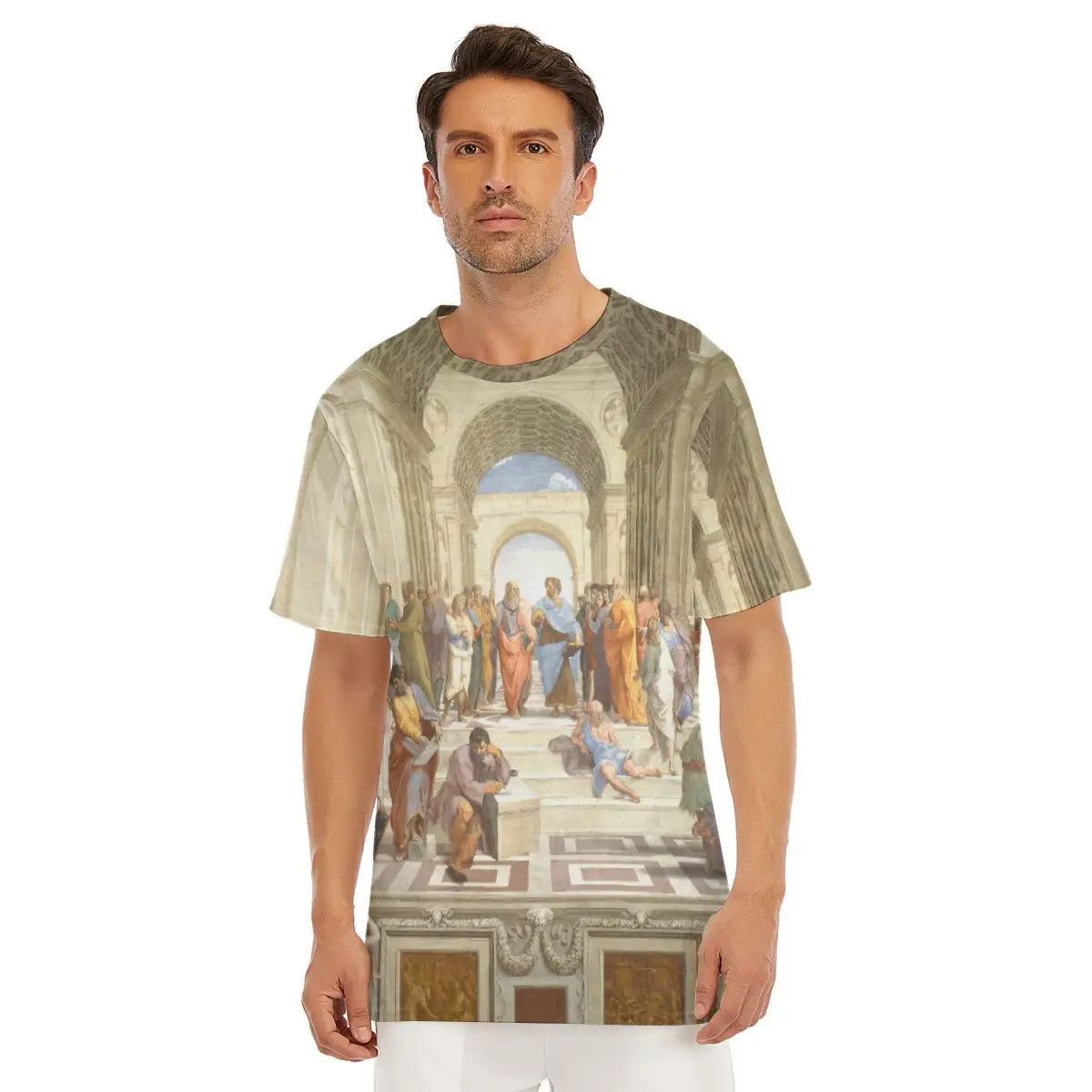 Male model wearing The School of Athens by Raphael All-Over Print T-shirt showcasing the monumental fresco with its iconic gathering of classical philosophers and mathematicians within Bramante's grand architectural setting