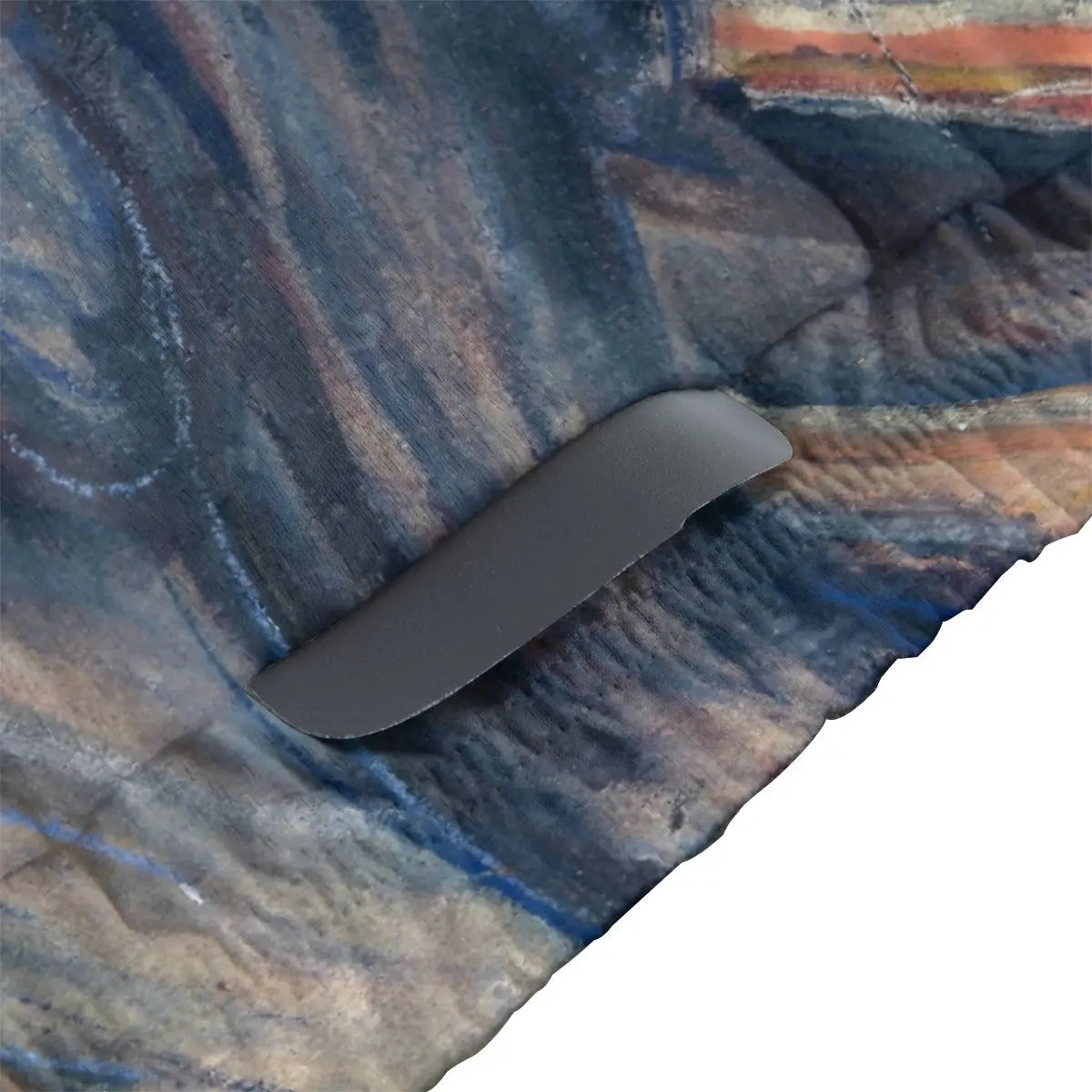 Close-up of secure non-slip rubber hem on Expressionist art cycling jersey maintaining position during intense effort