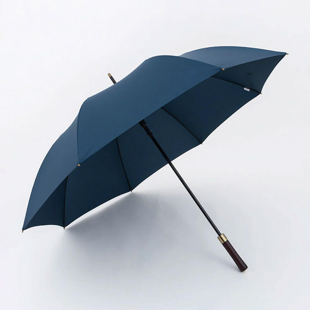 Vintage-inspired parasol sheltering from rain.