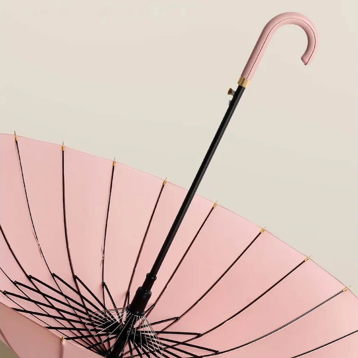 Professional woman walking with open pink luxury umbrella in light rain