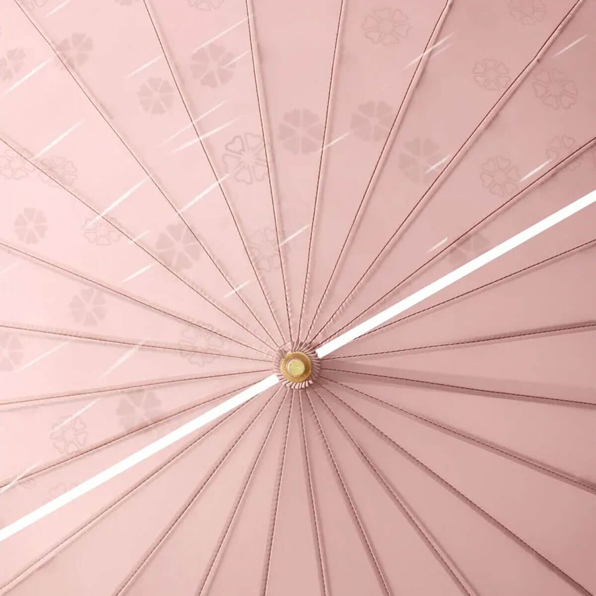 Closeup of water beading on pink luxury umbrella's pongee fabric surface