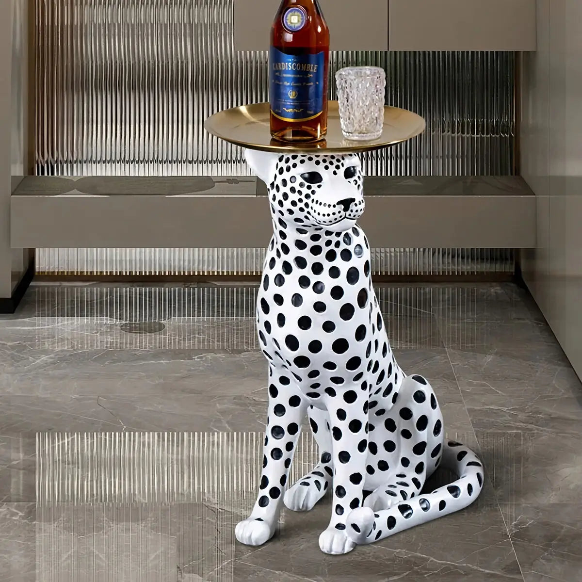 White Leopard Side Table styled as bedside table with lamp and books