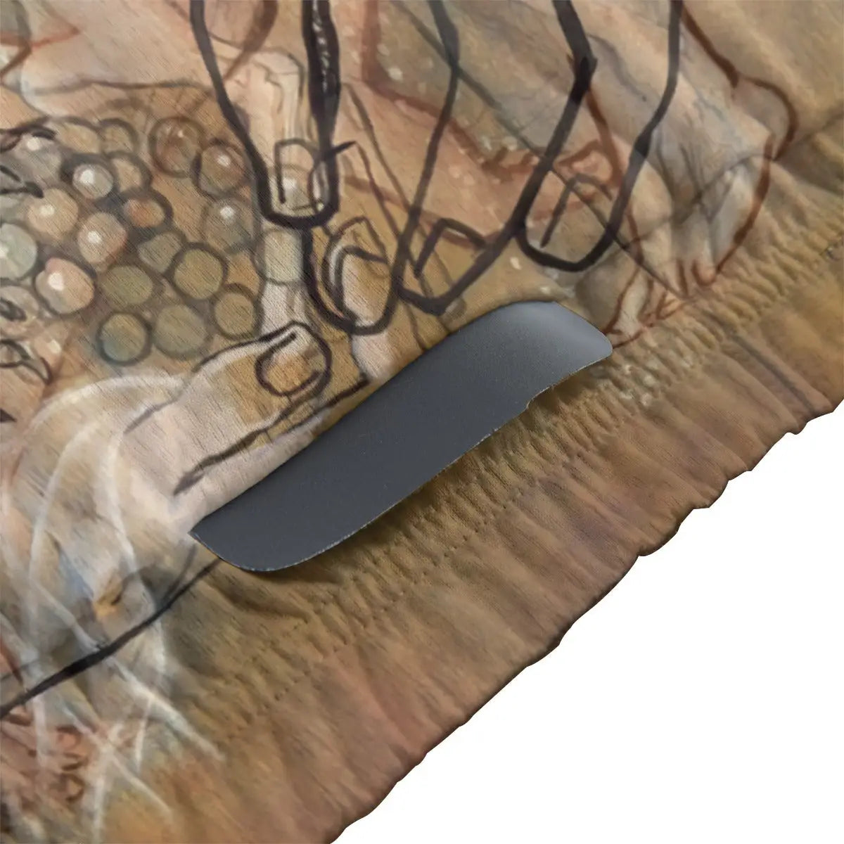 Close-up of secure non-slip rubber hem on transparency art cycling jersey maintaining position during complex ride