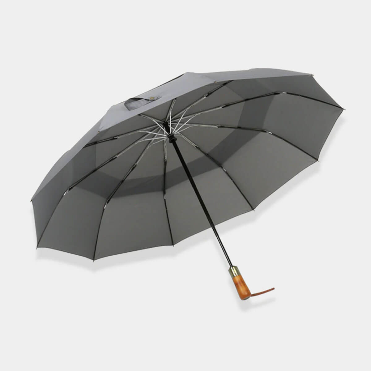 Elegant wooden handle umbrella complementing formal business attire