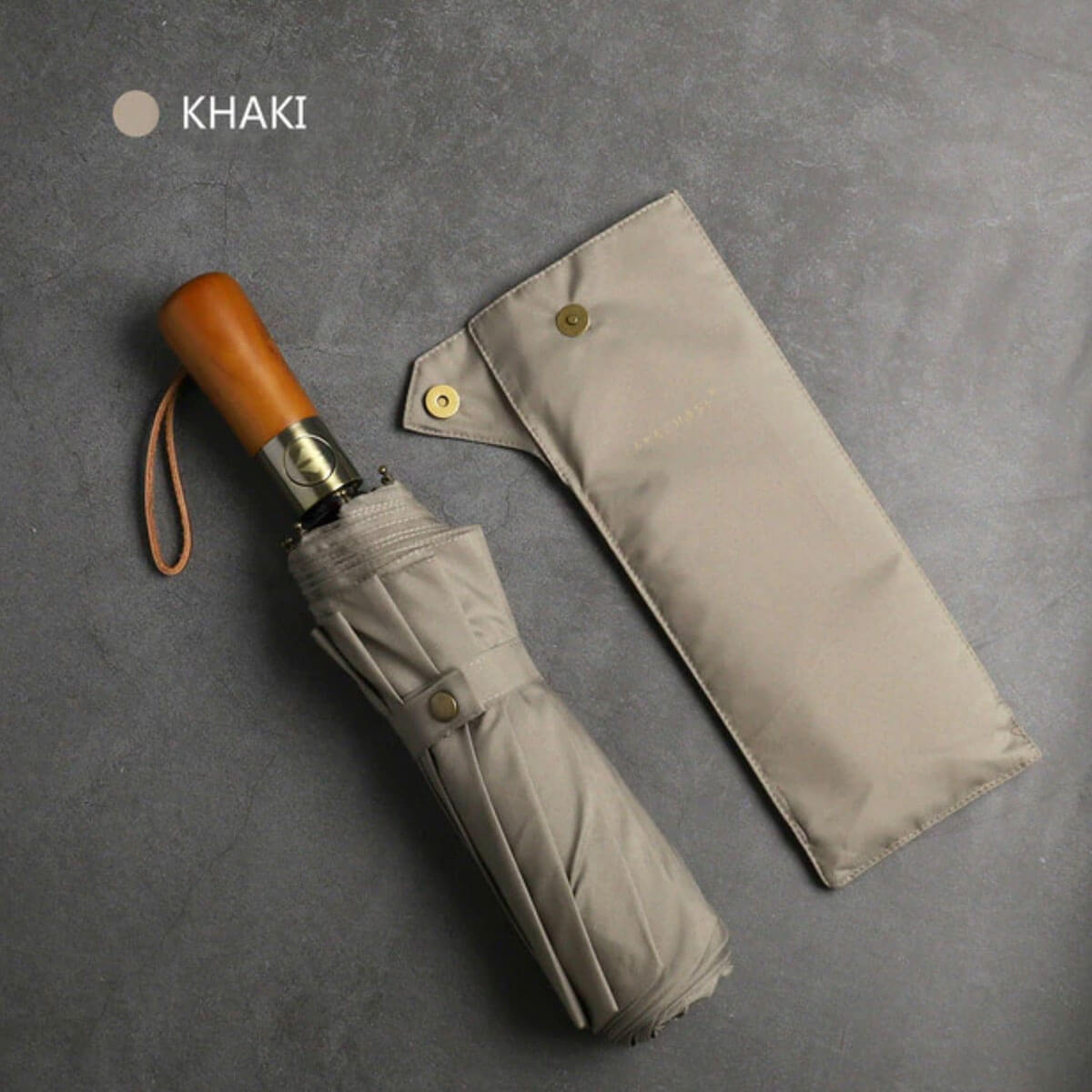 Automatic folding umbrella protecting against rain, showcasing size