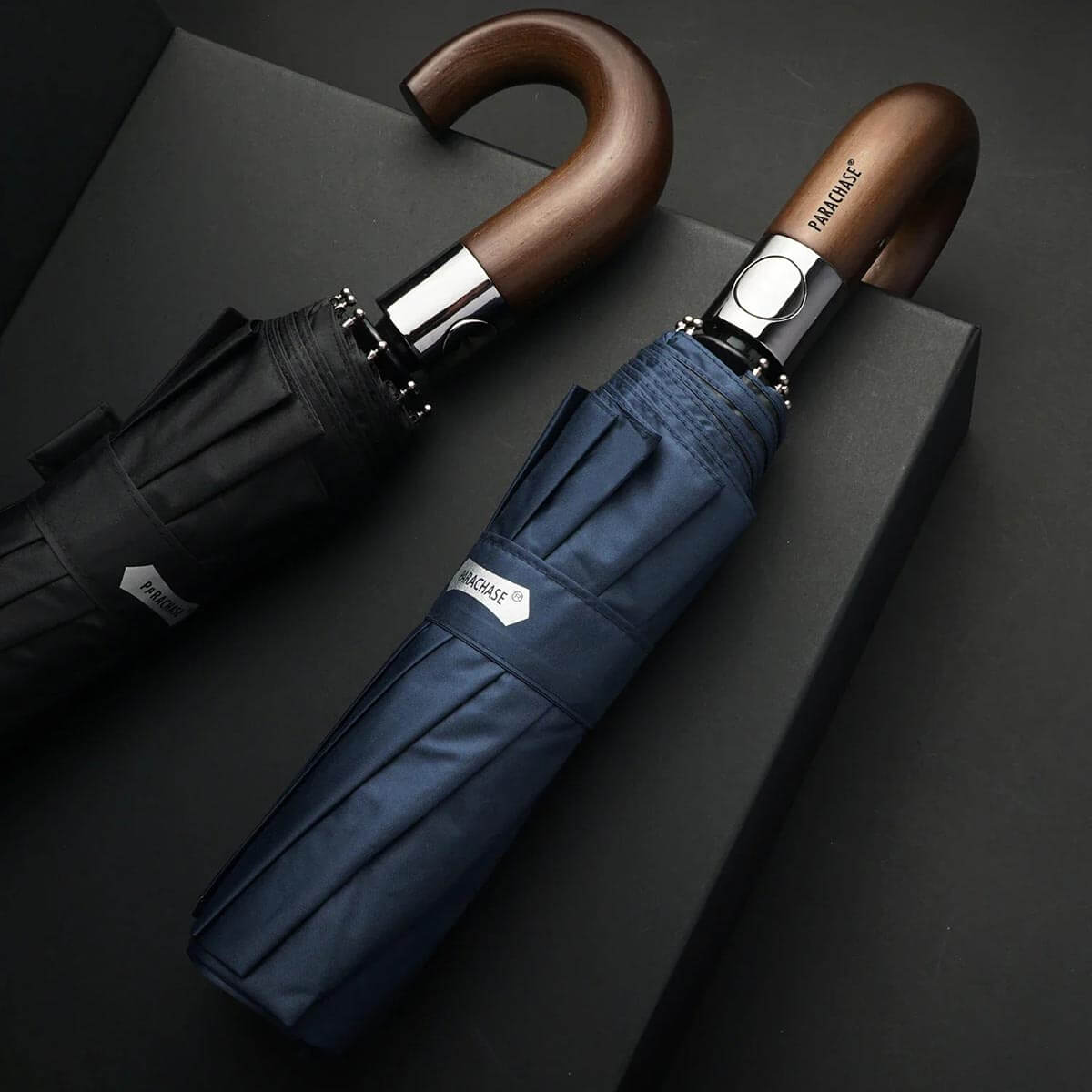 Compact navy umbrella with UV protection, open and closed view