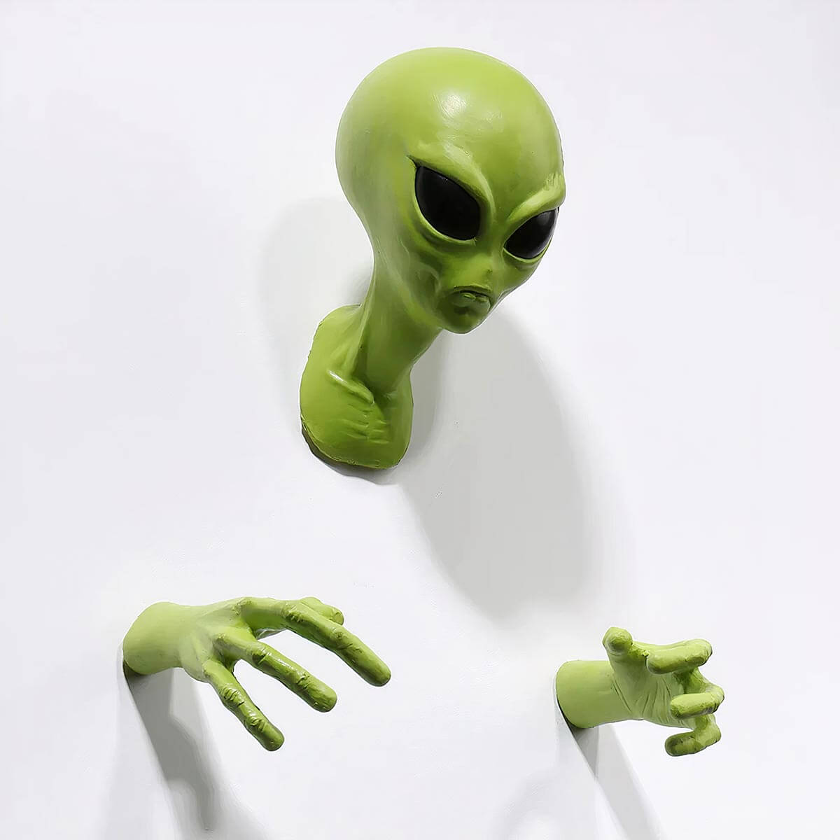 Green alien wall art adding character to living room decor