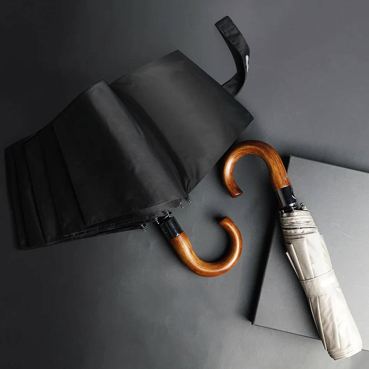 Navy blue rain umbrella featuring full-coverage canopy and wooden grip