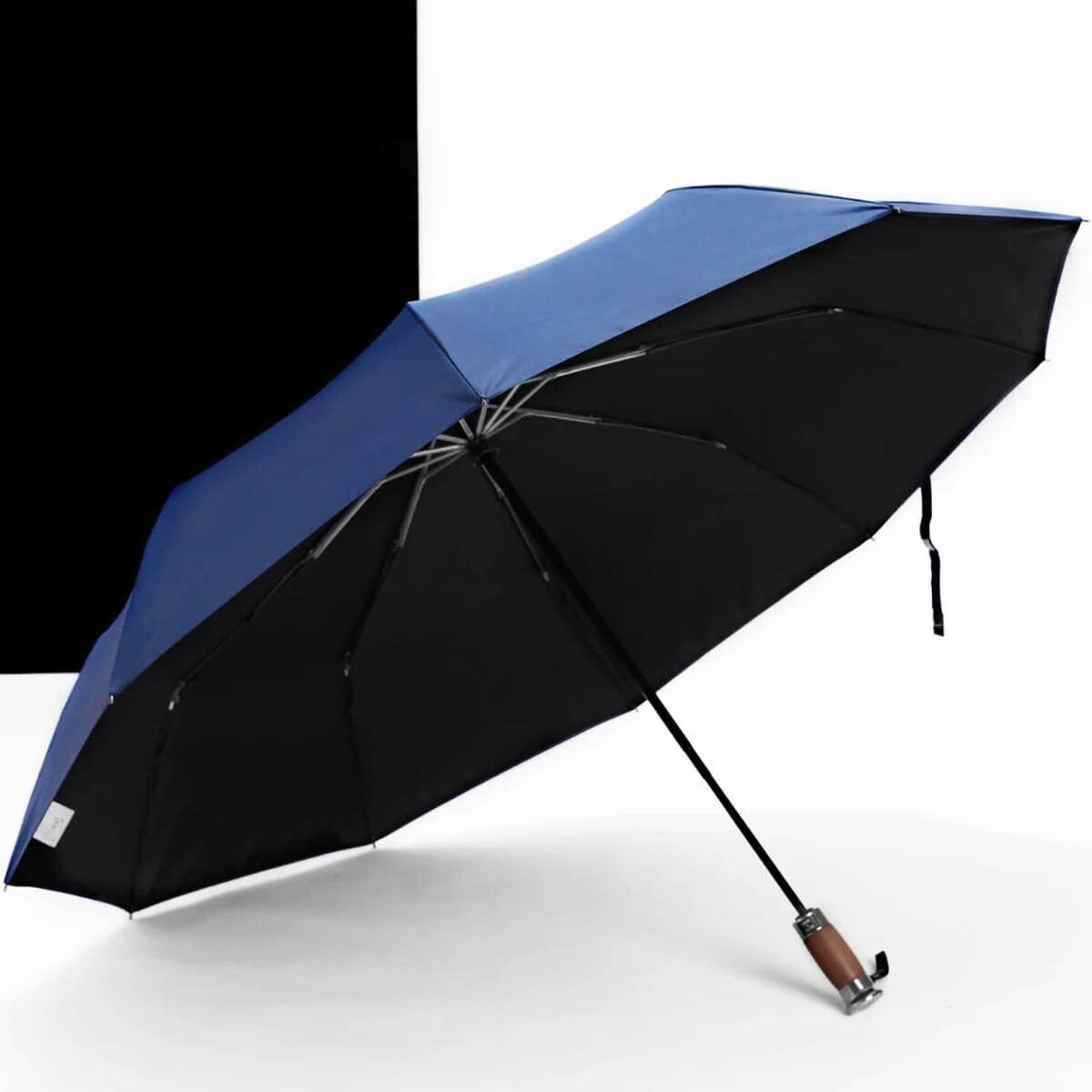 Compact folded view of luxury wooden handle umbrella for professionals