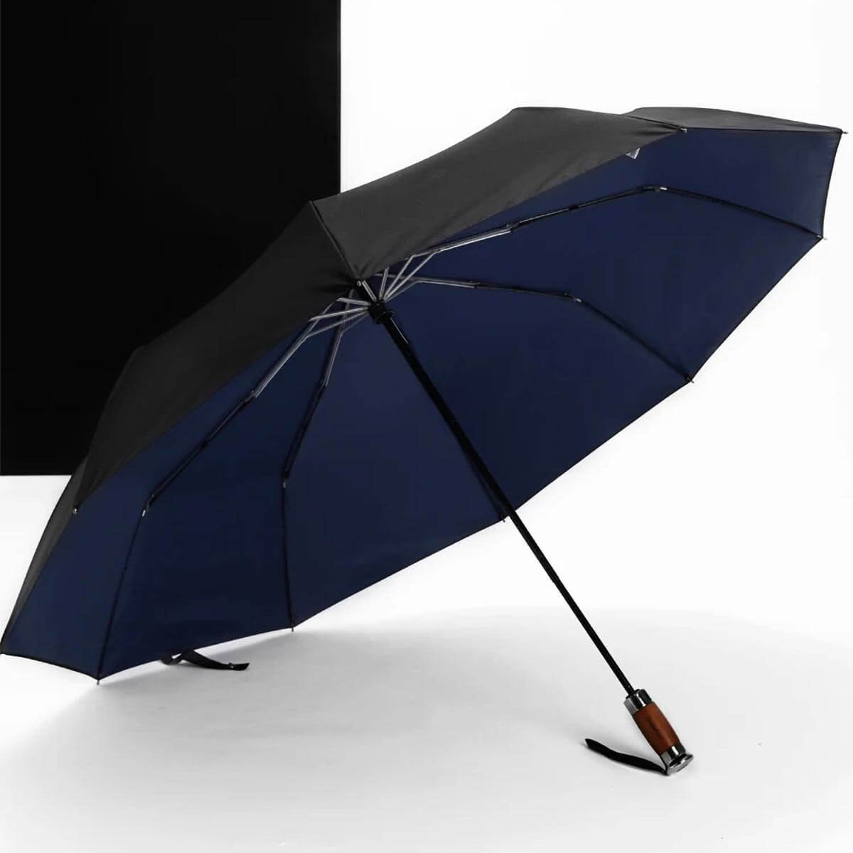 Detail of premium wooden handle on large folding business umbrella