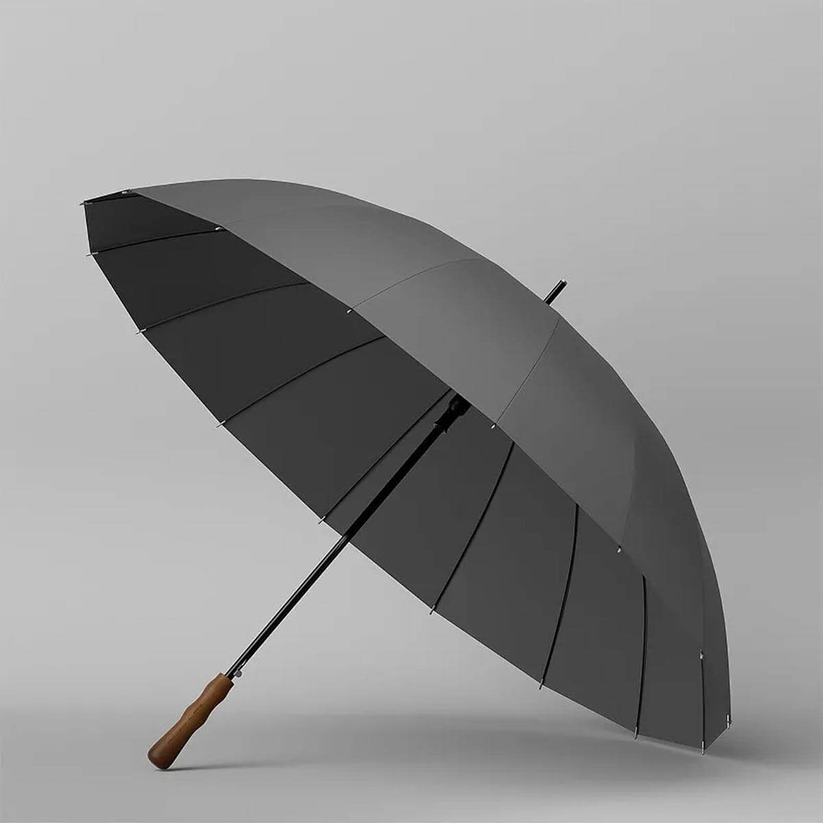 Executive carrying the folded Luxury Big Wooden Long Handle Umbrella, highlighting its portability