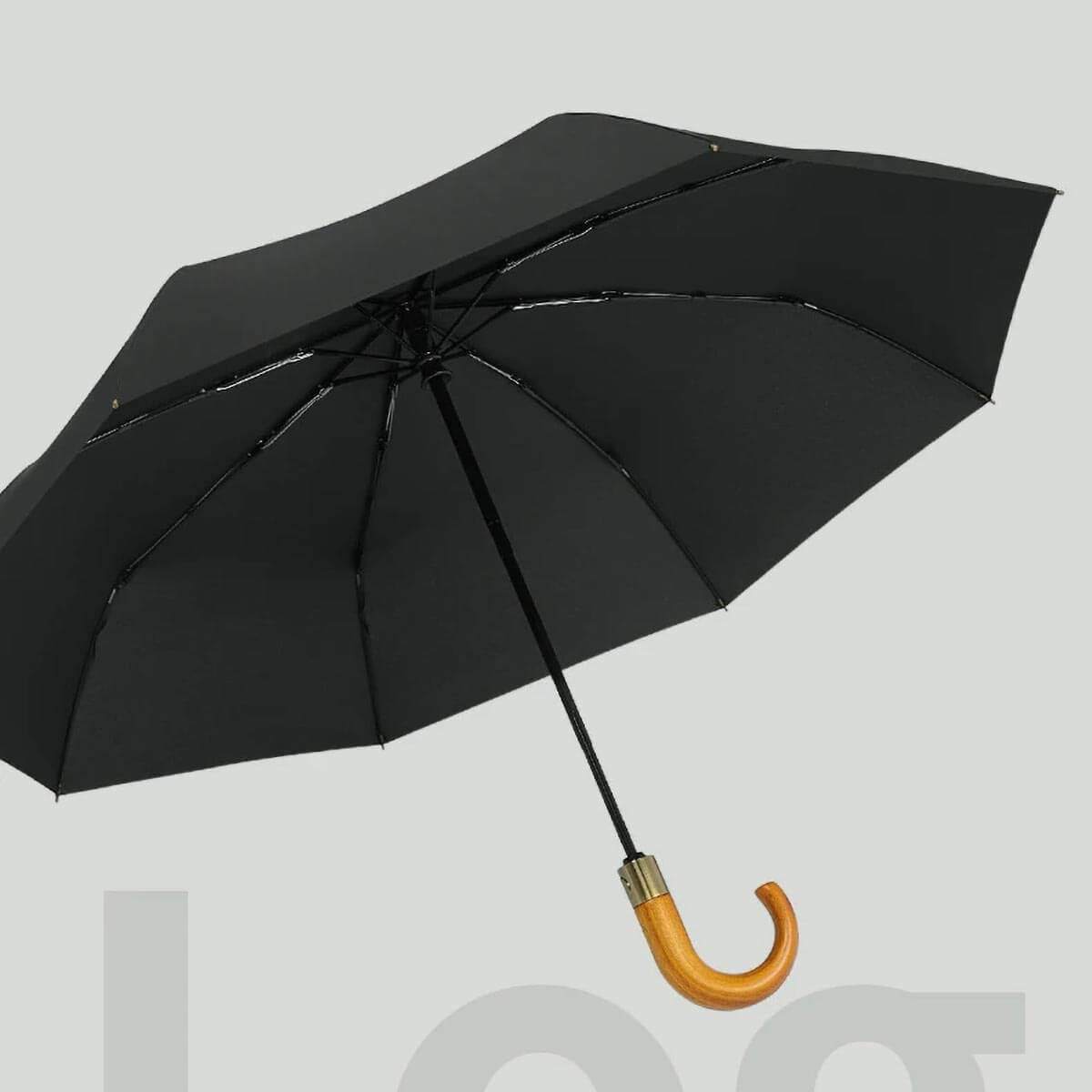 Foldable Umbrella's wooden handle close-up, highlighting premium feel