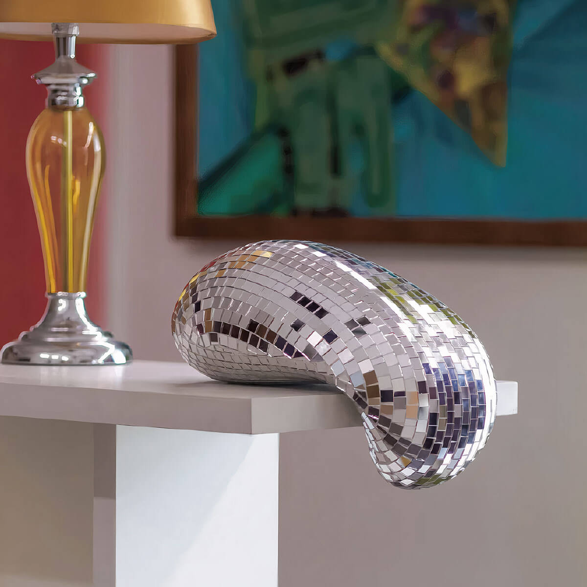 Eye-catching Melting Disco Ball accent piece with reflective glass surface