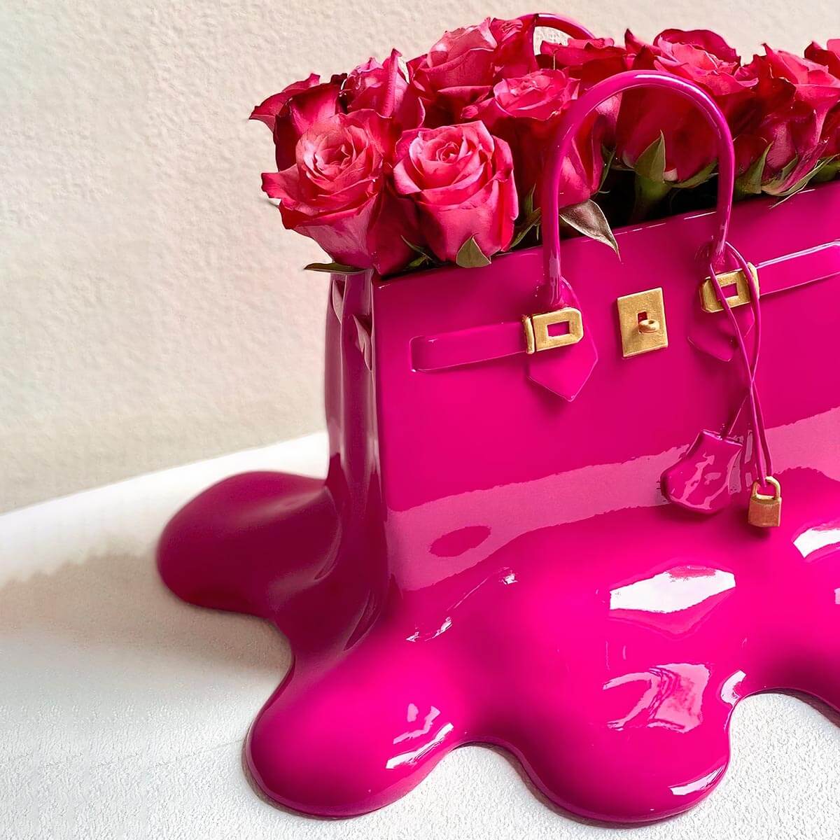 Stylish melting purse vase as dining table centerpiece