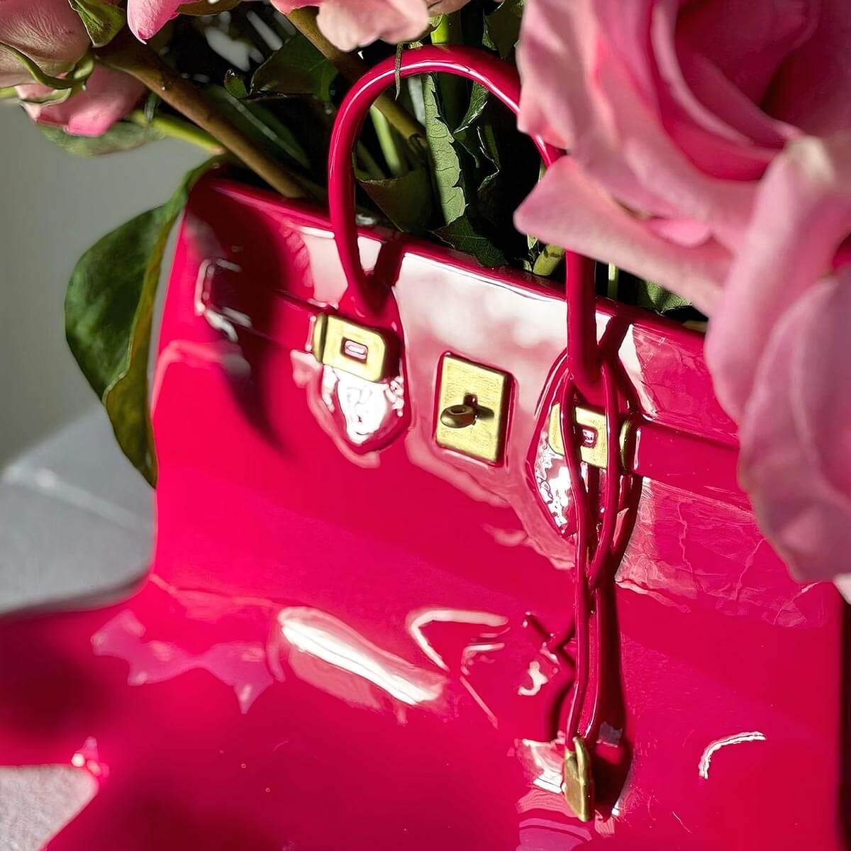 Close-up of surrealist handbag vase with roses