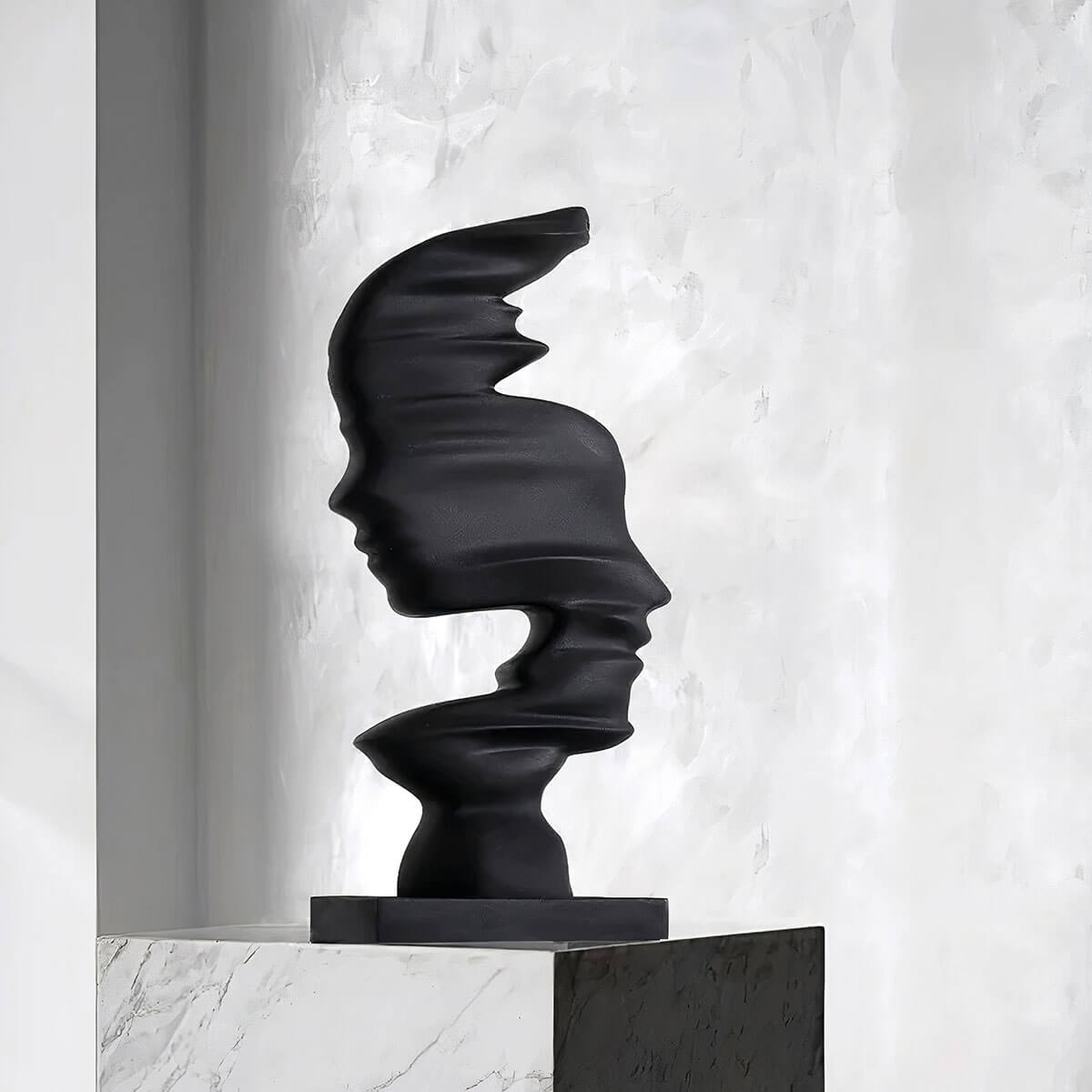 Artistic male and female face sculpture in minimalist design