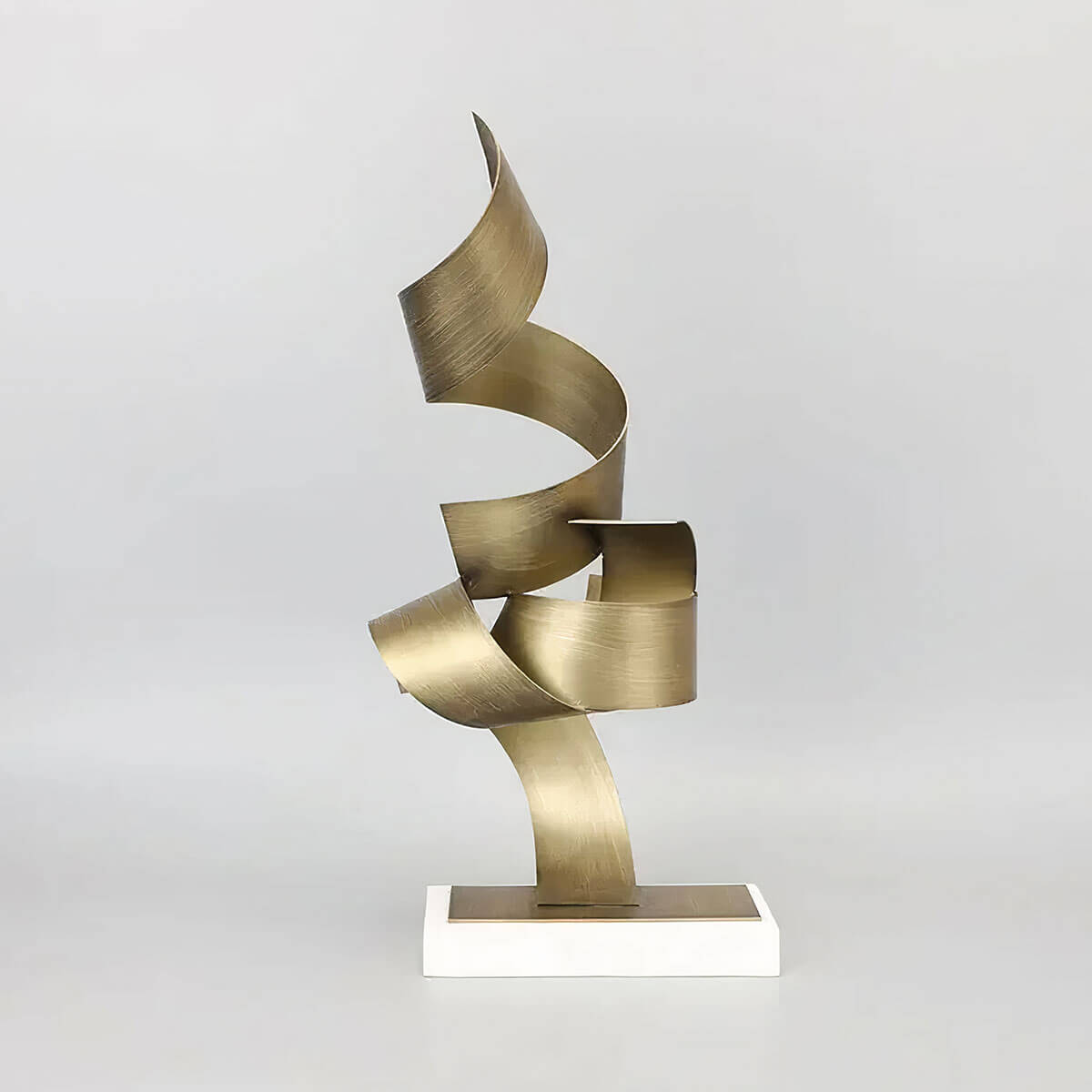 Modern golden sculpture on white background