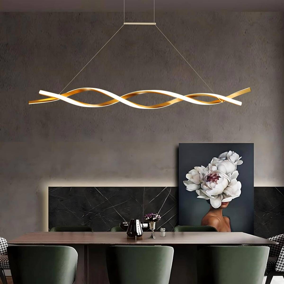 Elegant wave-inspired gold and white chandelier hanging in a modern dining room