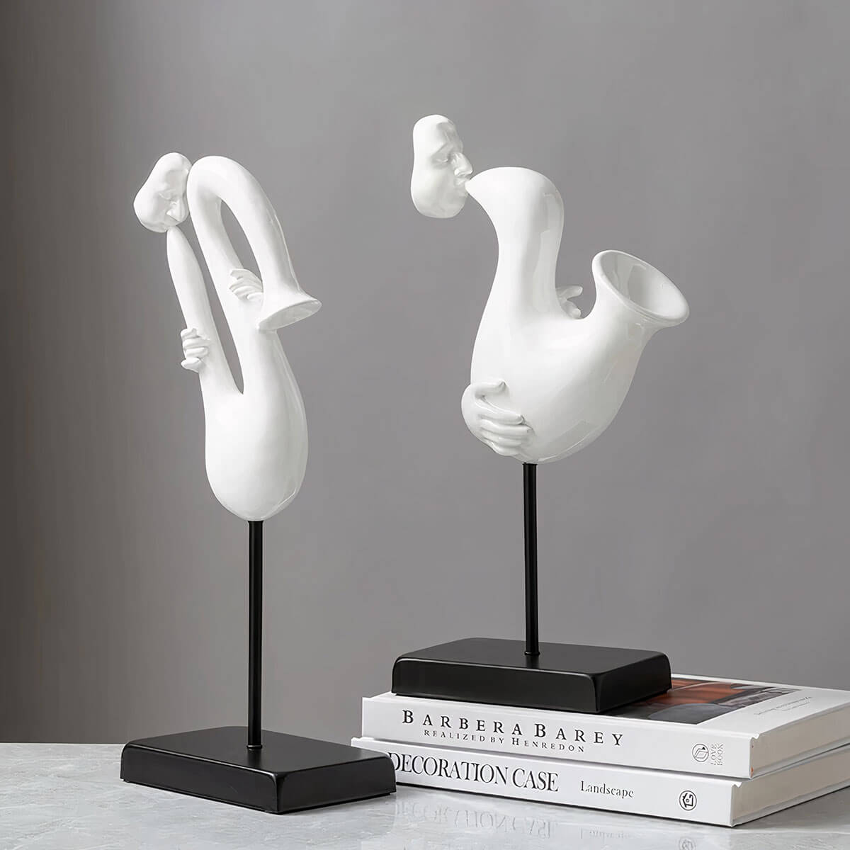 Complete set of five white musician sculptures displayed together