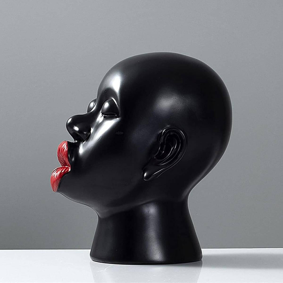 Close-up of Red Lips Sculpture surface, highlighting quality resin material and finish