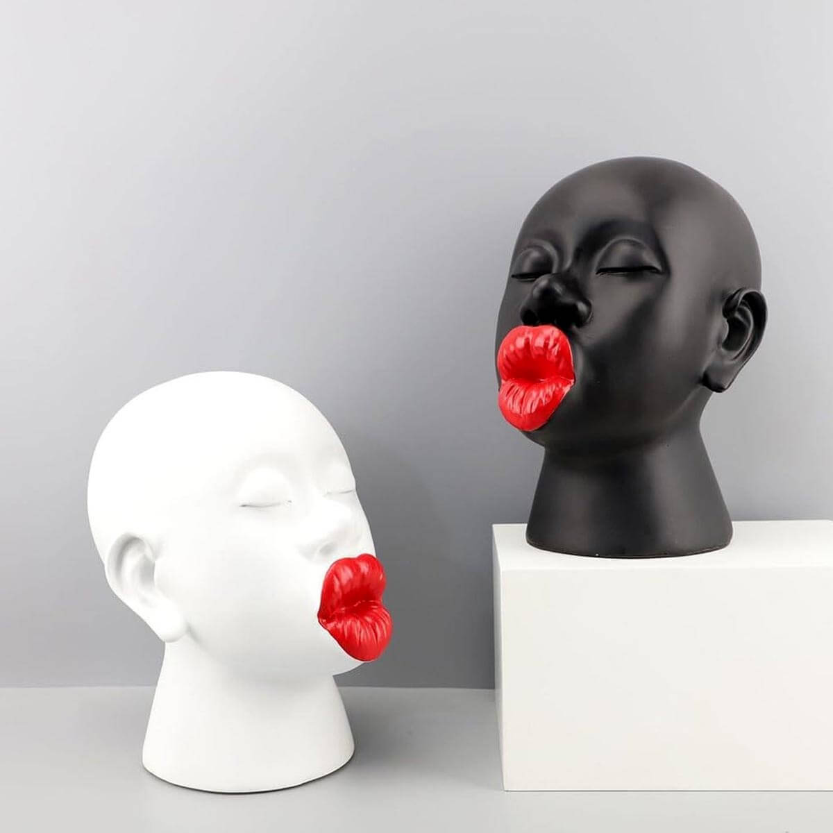 Red Lips Female Sculpture next to common objects for size reference, 21x24x28cm dimensions