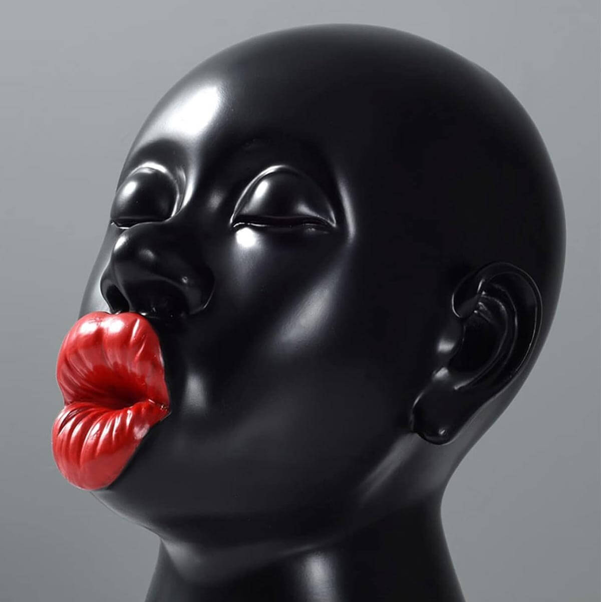 Elegantly packaged Red Lips Sculpture, perfect as artistic gift for various occasions