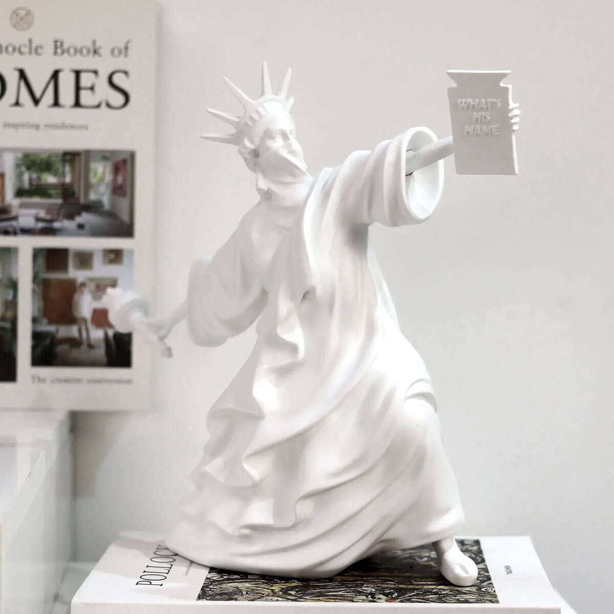 Contrasting white Statue of Liberty art piece on black surface