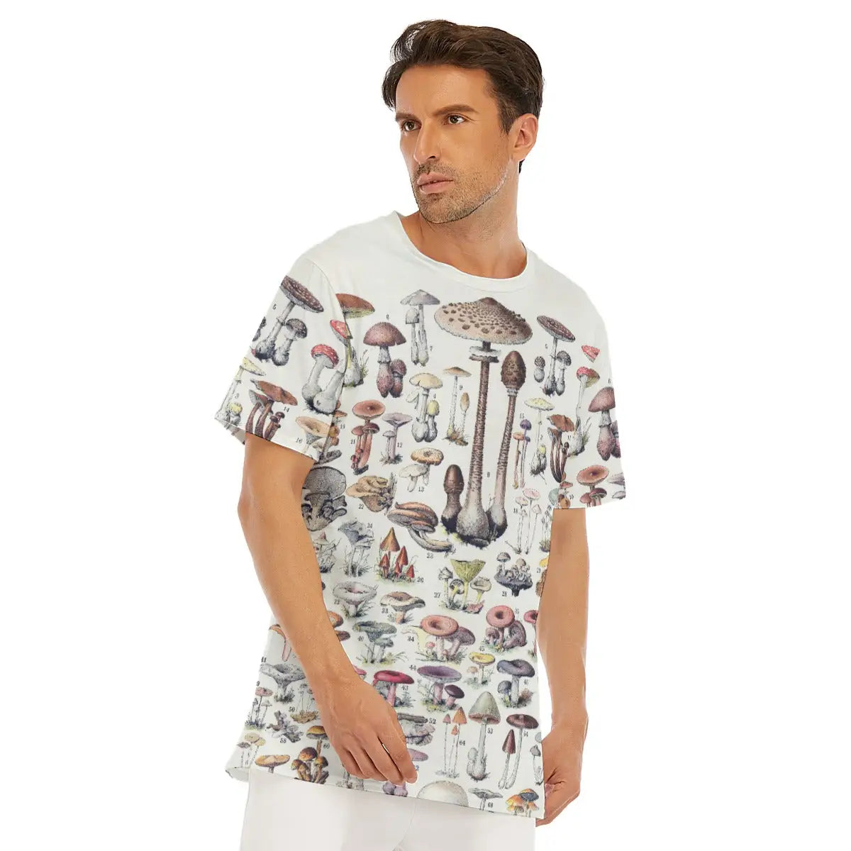 Mycological field guide T-shirt laid flat, displaying the entire collection of mushroom species, premium craftsmanship, and natural texture of the 100% cotton fabric that enhances the scientific quality of the reproduced fungi illustrations.